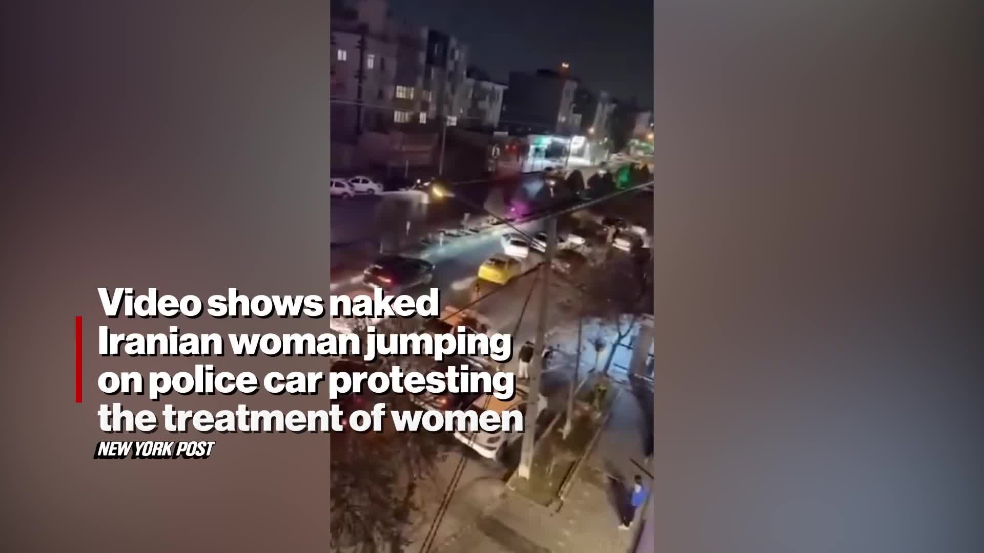 naked-iranian-woman-jumps-on-police-car-protesting-treatment-of-women-video-1738833676.mp4