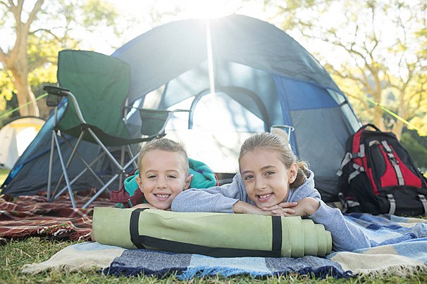 pngtree-smiling-siblings-lying-outside-the-tent-photo-image-29460484-1779206007.jpg