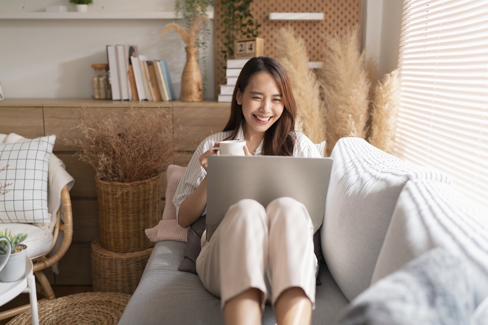 young-attractive-asian-female-working-home-hand-use-laptop-checking-search-schedule-working-process-planning-report-with-leis-1788426841.jpg