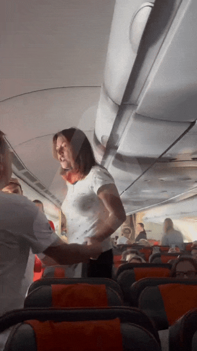 passenger-subdued-russian-airline-passenger-demands-business-class-upgrade-over-chest-butt-pain-tied-up-handed-to-police-1751013045.gif