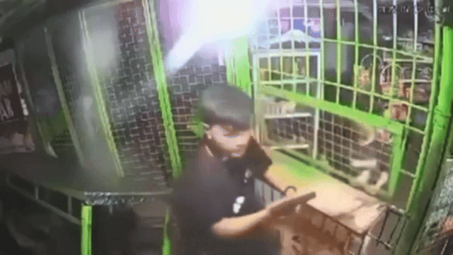 drunk-policeman-store-gun-1-drunk-policeman-in-philippines-threatens-store-customers-with-gun-assaults-woman-1752571929.gif