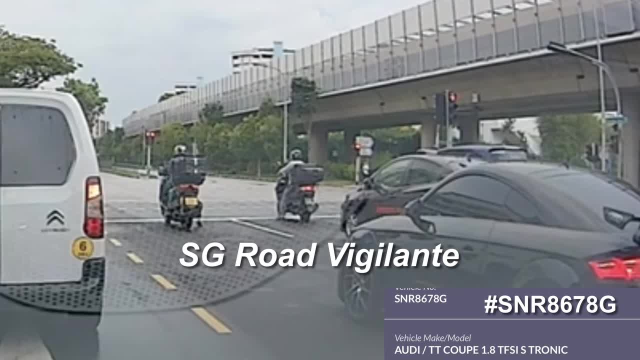 14nov2025-1610hrs-yishun-ave-2-snr8678g-audi-tt-moving-off-at-red-and-rear-ended-food-delivery-rider-at-traffic-light-junction-1763478581.mp4