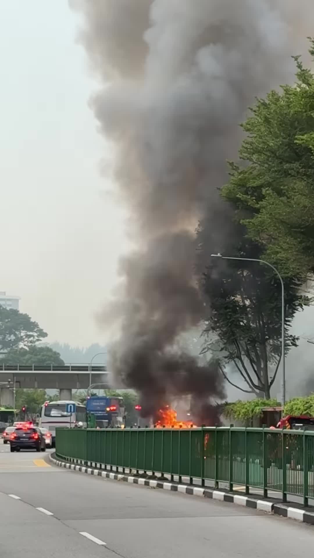 car-burning-on-it-own-not-ev-very-unlucky-driver-yet-responsible-still-help-to-divert-traffic-and-stopping-people-from-walking-near-the-scene-1741233180.mp4