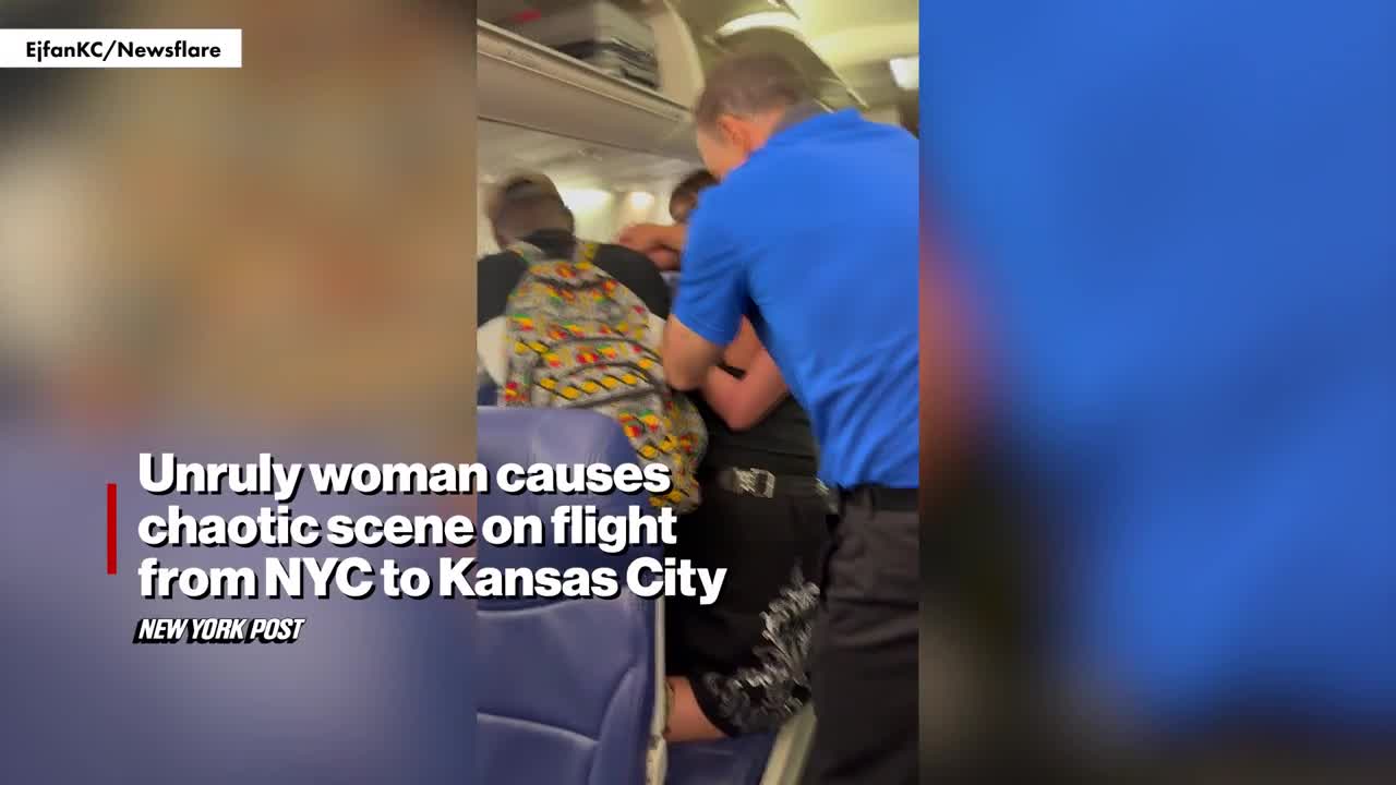 drunk-passenger-yanked-off-plane-after-grabbing-womans-hair-kicking-and-screaming-while-hands-are-tied-video-1750324655.mp4
