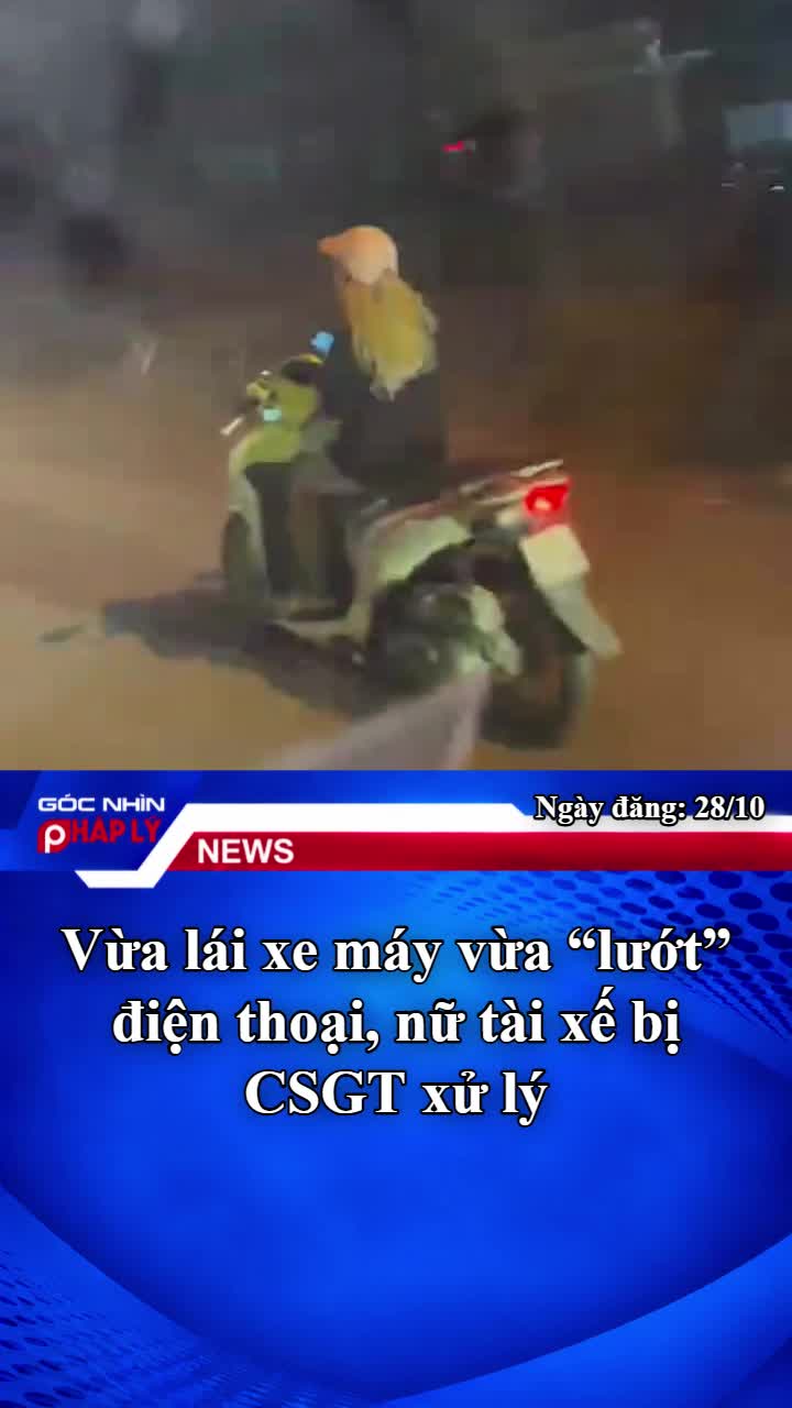 vua-lai-xe-may-vua-luot-dien-thoai-nu-tai-xe-bi-csgt-xu-ly-1-1793174811.mp4
