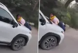Vợ bám nắp capo suốt 5 km sau khi phát hiện chồng đi cùng người phụ nữ khác