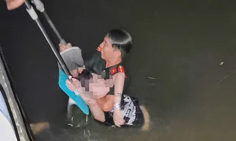 Đại úy công an lao xuống rạch cứu cô gái giữa đêm