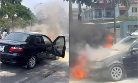 Ô tô bốc cháy ngùn ngụt, hai vợ chồng hoảng hốt mở tung cửa bỏ chạy