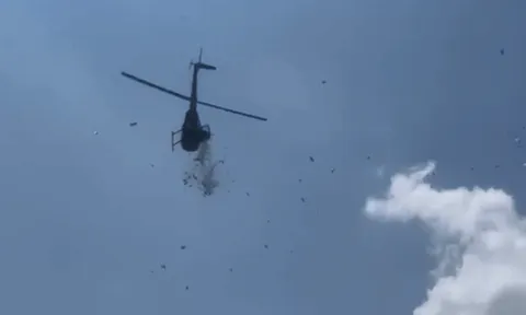 Cơn mưa tiền từ trực thăng - mọi người hân hoan nhận món quà cuối cùng của người đàn ông qua đời vì bệnh Alzheimer ở tuổi 58