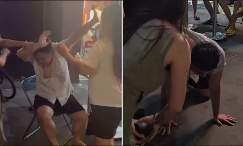 Clip: Nam thanh niên bị 2 người phụ nữ đánh hội đồng, xé áo, liên tục dập đầu xin lỗi