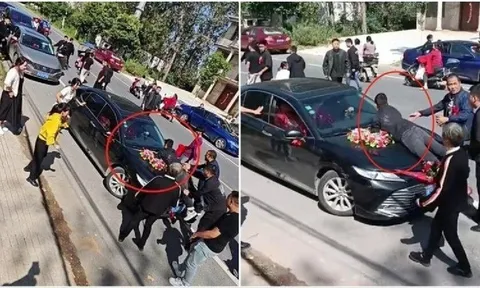 Chú rể ngỡ ngàng khi anh trai cô dâu chặn xe hoa, nằm dài trên capo đòi thêm 100 triệu đồng sính lễ giữa đường