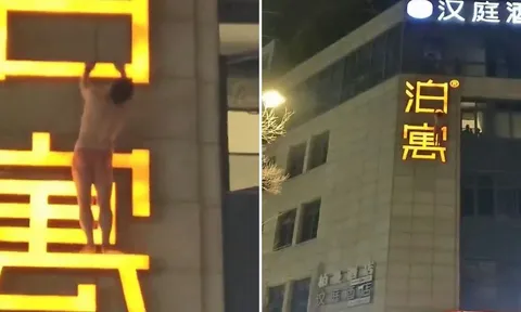 Người đàn ông khỏa thân "treo" lơ lửng ngoài biển hiệu khách sạn khiến cả con phố nín thở, dân mạng nghi bị bắt quả tang ngoại tình