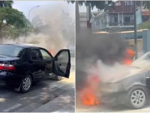 Ô tô bốc cháy ngùn ngụt, hai vợ chồng hoảng hốt mở tung cửa bỏ chạy