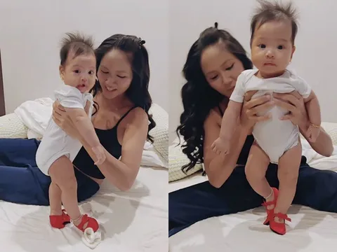 Con gái 5 tháng tuổi của Hoa hậu H'Hen Niê đeo vàng bạc đầy người, biểu cảm hài hước khi đi giày cao gót