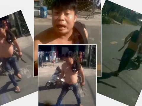 Người đàn ông lăm lăm hung khí, bất ngờ đập phá xe tải giữa đường gây náo loạn