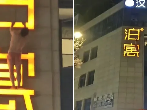 Người đàn ông khỏa thân "treo" lơ lửng ngoài biển hiệu khách sạn khiến cả con phố nín thở, dân mạng nghi bị bắt quả tang ngoại tình