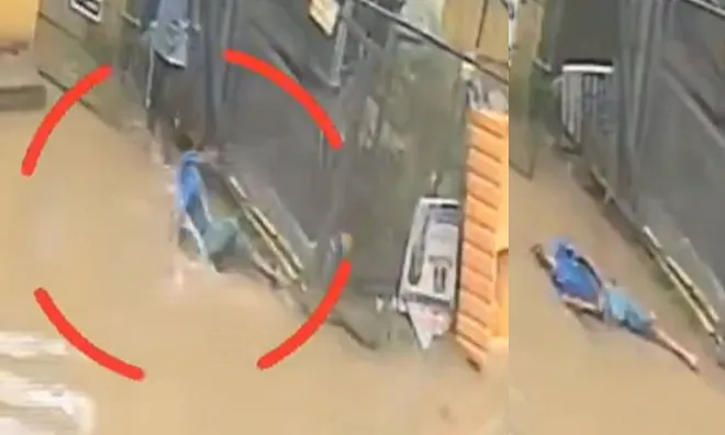 Camera ghi lại khoảnh khắc nam bảo vệ bất nhờ ngã gục giữa con đường ngập nước, nguyên nhân phía sau khiến nhiều người ám ảnh