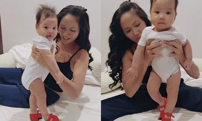 Con gái 5 tháng tuổi của Hoa hậu H'Hen Niê đeo vàng bạc đầy người, biểu cảm hài hước khi đi giày cao gót