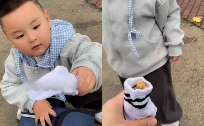 Đến trường đón con tan học, ông bố phát hiện bất thường ở chân con, nhìn thấy vật thể lạ trong đôi tất mà xúc động